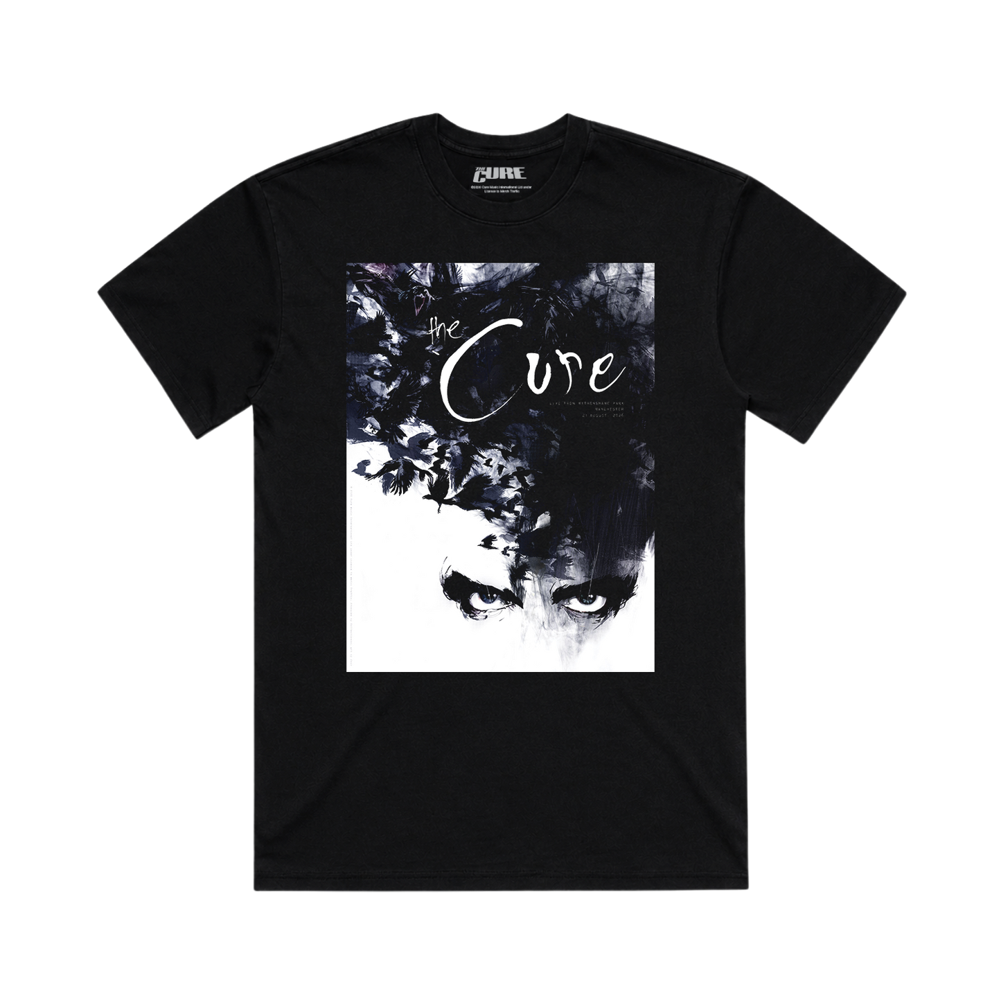 A black short-sleeve crewneck t-shirt featuring a large square graphic print on the front. The graphic is a high-contrast black and white artistic portrait of a face with the words 'the Cure' written across it.
