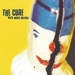 Album cover for 'Wild Mood Swings' by The Cure with a stylized face and colorful design.